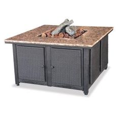 an outdoor fire pit with granite top and two doors on the sides, in front of a white background