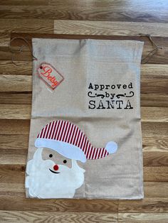 "It's never too early to start thinking about the holidays! Make Christmas more special with a personalized Santa sack, featuring an appliquéd Santa on a soft, burlap sack with the words, \"Approved by Santa\" and featuring an embroidered tag with your choice of personalization.  Surprise your little ones on Christmas morning with this unique Santa bag, a Christmas bag that can become part of your holiday decor as well! These Christmas sacks can be used year after year to become wonderful Christ Custom Santa Sack, Personalized Hand Towels, Christmas Hostess Gifts, Christmas Hand Towels, Personalised Santa Sacks, Dog Christmas Stocking, Santa Bags, Burlap Sacks, Christmas Sack