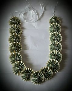 a necklace made out of dollar bills