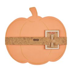 an orange pumpkin shaped box with a ribbon around it