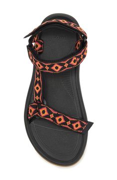 Adjustable hook-and-loop straps mean a custom fit in a water-ready sandal featuring a shock pad and padded heel for additional cushioning. Adjustable straps with hook-and-loop closure Cushioned footbed Textile upper/ textile and synthetic lining and sole Imported Men's Shoes Black T-strap Sandals With Adjustable Straps, Black Strap Sandals For Outdoor, Casual Black Sport Sandals With Strap, Adjustable Strap Black Sport Sandals, Black Sport Sandals With Adjustable Strap, Synthetic Strap Sport Sandals For Outdoor, Black Sport Sandals With Adjustable Straps And Round Toe, Adjustable Strap Open Toe Sport Sandals, Adjustable Ankle Strap Sport Sandals For Outdoor