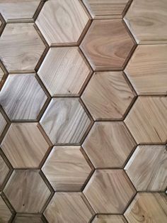 wooden tiles are arranged in the shape of hexagonals