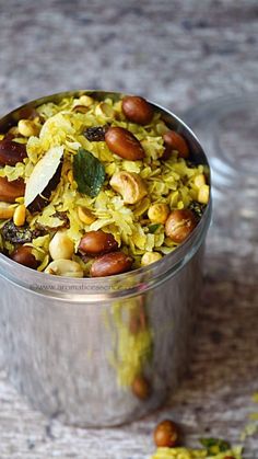 a metal container filled with food on top of a table