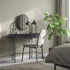 a bedroom scene with focus on the desk and chair next to the bed, along with a potted plant