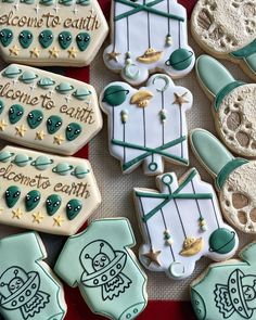 some decorated cookies are sitting on a table