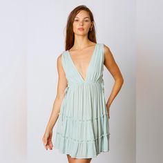 This Deep V Swing Dress Showcases An Alluring Silhouette With Beautiful Ruffle And Lace Up Side Cut Out Details. Perfect For A Beach Or Boho Look, This Dress Will Make You Stand Out In Any Occasion. Color: Mint Self 100% Rayon White Gold Dress, Corduroy Overall Dress, Patch Dress, Pink Homecoming Dress, Polo Shirt Dress, Beachy Boho, Blue Sleeveless Dress, Striped Mini Dress, Boho Look