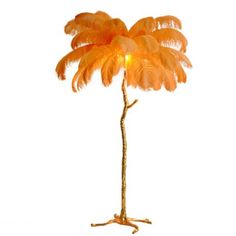 an orange palm tree lamp on a white background