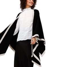 A sumptuously soft cape with a striking two-tone palette, the Colorado Cape is the ultimate style for warming up this winter. The perfect piece for throwing on over jeans and boots - you'll achieve effortless style with ease. • Open front• Contrast rib neckline and hem• Fine knit• One size garment 72% Viscose28% Nylon Body Width: OS: 128cmLength: OS: 72cm Care: cold hand wash with like colors do not bleach do not tumble dry, do not ring or twist dry flat do not iron do not dry clean Chic Black Poncho For Layering, Jeans Boots, Warming Up, Cold Hands, Ribbed Neckline, Front Open, Jeans And Boots, Effortless Style, Two Tone