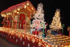 a house covered in christmas lights and decorations