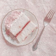 a piece of cake on a plate next to a fork