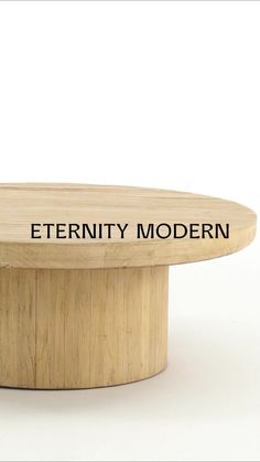 a wooden table with the words'eternity modern'written on it in black ink