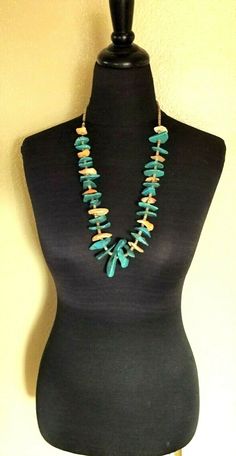 "VINTAGE NAVAJO TURQUOISE NECKLACE DESCRIPTION: This impressive strand features gorgeous specimens of polished Easter Blue turquoise and orange spiny oyster shell spaced with fine hand-rolled shell heishi. This breathtaking necklace will be a valuable addition to your collection of fine vintage Native American jewelry. MEASUREMENTS: Necklace measures 30\" end to end Large turquoise specimen measures 60mm long Beads are securely strung on natural fiber WEIGHT: 168.0 grams SIGNED: no" Turquoise Shell Necklace, Turquoise Ocean-inspired Necklace With Natural Stones, Ocean-inspired Turquoise Necklace With Natural Stones, Unique Shell-shaped Necklace With Natural Stones, Unique Orange Necklaces For The Beach, Unique Orange Beach Necklaces, Unique Orange Necklace For Beach, Handmade Turquoise Shell-shaped Necklace, Jewelry Measurements