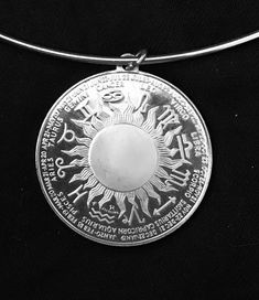 This is a sterling silver Scorpio Zodiac coin pendant. It contains .835 oz. of silver, The obverse features Scorpio and the reverse features all 12 constellation zodiac signs. It has been encased to allow wearing as a pendant on the SS marked wire choker. It is hard to photograph but SS marking is on the hook of the fastener. Simple hook and chain eye closure which allows about 1" adjustment in size 15" to 16" neck size. It appears in excellent condition.  Nice piece for any Scorpio -- October 24 thru November 22 Silver Zodiac Sign Round Necklace, Silver Round Zodiac Sign Necklaces, Silver Round Zodiac Sign Necklace, Silver Zodiac Sign Amulet Jewelry, Symbolic Zodiac Sign Collectible Jewelry, Symbolic Zodiac Sign Jewelry, Round Zodiac Sign Jewelry Collectible, Collectible Round Zodiac Sign Jewelry, Silver Zodiac Sign Medallion Jewelry