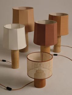 several lamps with different shades and sizes on them