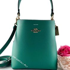 100% Authentic Brand New With Tag Sold Out In All Stores Excellent Gift - Includes Gift Bag Nwt Coach Small Town Bucket Bag In Beautiful Jade Color Soft Leather With Pink Interior. [Bag] Color: Gold/Bright Jade Double Face Leather Center Zip Compartment Snap Closure Handle With 6 3/4" Drop Detachable Strap With 22" Drop For Shoulder Or Crossbody Wear 8 1/2" (L) X 8 3/4" (H) X 4" (W) Includes:Coach Price Tag,Care Card & Gift Bag Fast Shipping Smoke-Free Home Coach Belt Bag, Coach Saddle Bag, Jade Color, Coach Crossbody Purse, Convertible Crossbody Bag, Brown Crossbody Bag, Pink Interior, Coach Shoulder Bag, Trending Handbag