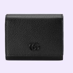 Authentic Gucci Gg Marmont Trifold Wallet This Gg Marmont Tri-Fold Wallet In Black Leather Features Six Card Slots And Three Open Pockets, Complete With Snap-Button Closure. The Double G Appears In Tonal Black Resin, Resulting In A Modern Interpretation Of Historical Hardware. Black Leather Black Resin Hardware Double G Inside: 4 Open Pockets, 1 Bill Compartment Outside: Snap Pocket, Back Zipper Pocket Snap-Button Closure Closed: 4.3"W X 3.3"H X 1.4"D Open: 9.4"W X 4.3"H Made In Italy 8 Gucci Bifold Evening Wallet, Elegant Gucci Bifold Wallet, Elegant Gucci Bifold Bag, Gucci Rectangular Evening Wallets, Gucci Evening Wallets Rectangular, Classic Gucci Wallet For Evening, Elegant Gucci Bag With Card Slots, Luxury Gucci Wallet For Evening, Gucci Evening Wallets