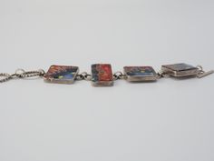 "Listing is for a Unique Art Studio abstract Avant-Garde cloisonné enamel / glass mosaic sterling silver toggle bracelet. Designer signed bracelet with unique microcellular abstract design with 4 sterling silver panels. Bracelet measures 8\" end to end, square panels measure 1\" x 1\", rectangular is 1.3\" x 0.7\". Bracelet is tested positive for silver by acid & magnet testing. Bracelet is engraved on the back. Weight is 82.6 grams. No surface scratches on the glass. Unique one of a kind ha Collectible Enamel Bracelet Jewelry, Multicolor Enamel Jewelry With Lobster Clasp, Contemporary Bracelet Jewelry Gift, Enamel Bracelet Jewelry With Lobster Clasp, Enamel Bracelet With Lobster Clasp, Artistic Rectangular Jewelry For Jewelry Making, Artistic Red Enamel Jewelry, Multicolor Cabochon Enamel Jewelry, Artsy Bracelet Jewelry Gift