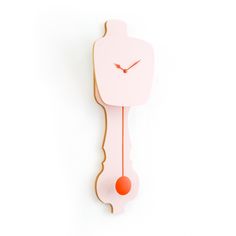 a pink clock with an orange pendulum on it