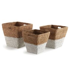 three brown and white baskets sitting next to each other