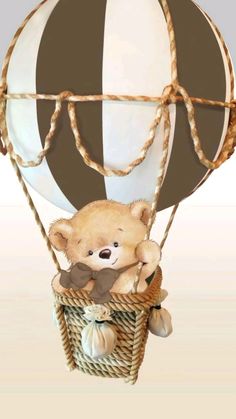 a teddy bear in a hot air balloon that is brown and white with a black stripe