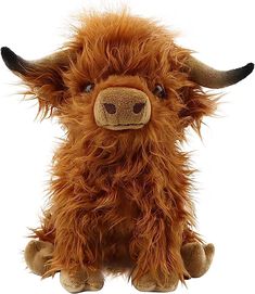 the stuffed animal is brown and has long horns