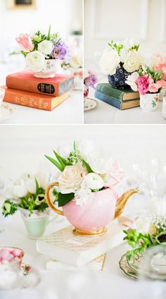 a table topped with books and vases filled with flowers on top of each other