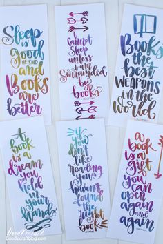 four watercolor bookmarks with hand lettering on them