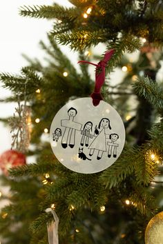 a christmas ornament hanging from the top of a tree