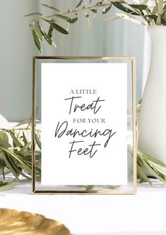 a little treat for your dancing feet sign on a table next to a vase with greenery