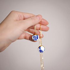 A single, shell-like style of porcelain with a varied, blue and white floral design in this coin pendant necklace. For a clean, everyday look, the white version makes for a classic statement with just enough style. The melted 22k gold is lustered on and melted in a French Tip design. This highlights the slight carved features of this porcelain necklace. Perfect for weddings but frankly, worn daily is just the right touch of sweetly unique for this mini statement piece. Chainware is 14k goldfille French Tip Design, Porcelain Necklace, Crescent Necklace, Coin Pendant Necklace, Floral Necklace, Coin Pendant, 22k Gold, Everyday Look, Shells