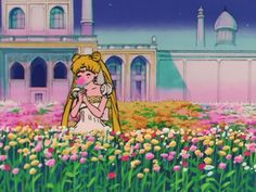 an animated scene with a girl in a field of flowers and a castle behind her