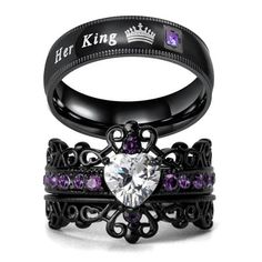 two black rings with purple stones in the middle and one has a crown on top