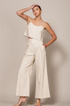 Flow-y wide legs punctuate these linen-blend pants designed with a pretty pearl trim at the ankles. • Pleated Detail• Side Zipper• Banded Waist• Pearl Trim• Pockets Linen Wide Leg Pants, Linen Crop Top, Fantasy Wardrobe, Linen Blend Pants, Wide Leg Linen Pants, Pants Design, The Pearl, Wide Legs, New Tops