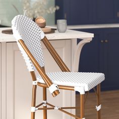 a white and brown chair sitting on top of a kitchen counter