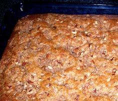 a pan filled with food sitting on top of a stove