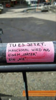 there is a pink sticker on the end of a metal pole that says tues - jert