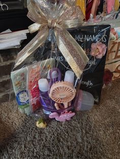 a basket filled with lots of items on top of a carpet