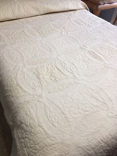 Rare offer - Full size bed Double Wedding Ring Quilt.   This would be a perfect gift for a young couple. It is machine quilted with lots of stipple quilting all over. The color is a dark ivory.  It has scalloped edges with a beautiful block center design. It will certainly become an heirloom for the purchaser.  I have two of these available that could be perfect for a bride and groom.  However, size and color is an option for the purchaser.  Any color combination can be accommodated but we will Wedding Dress Quilt, Block Center, Double Wedding Ring, Double Wedding Ring Quilt, Bed Double, King Size Comforters, Whole Cloth Quilts, Double Wedding Rings, Wedding Ring Quilt