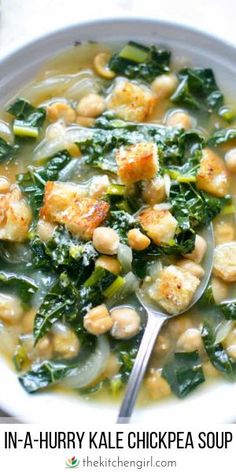 a white bowl filled with chicken and spinach soup