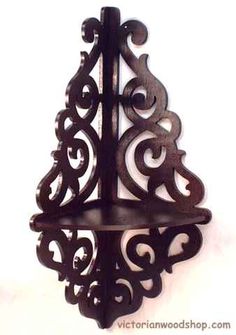 a metal shelf with an ornate design on it