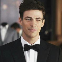 a man in a tuxedo and bow tie