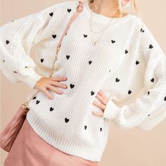 SWEATER WEATHER 🖤 HEARTS Warm ivory knit sweater with black heart detail Ribbed trim, cuffs, & hem Oversized, relaxed fit Fits true to size 85% Acyrlic, 15% Polyester Available in standard & plus sizing Measurements approximately: Small: Bust 48", Waist 30", Length 25" Medium: Bust 52", Waist 32", Length 25.5" Large: Bust 56", Waist 34", Length 26" Black Hearts, Heart To Heart, Ivory Sweater, Heart Sweatshirt, Heart Sweater, Large Sweaters, Embroidered Heart, Embroidered Sweater, Knitted Dolls