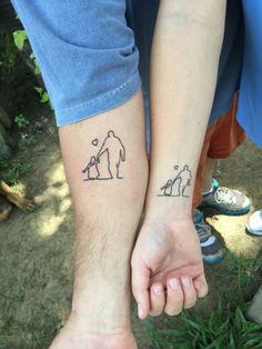 two people are holding hands with tattoos on their arms and one has a dog in the other's hand