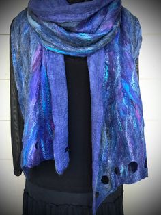 "Vibrant blues with hints of purples, turquoise, with white accents Nuno felted through hand-dyed cotton gauze.  Cutaways at each end add interest to this lovely soft, lightweight wrap.  The silk blended fibers add texture, dimension and shine.  Wonderfully soft wrap. Unisex Scarf.   Nuno Felted as One of a Kind; Art To Wear.  (Brooch Sold Separately) Approx. 15\" x 95\" Featured on Instagram:  #scarvesbysuzanne Featured on Pinterest:  Art To Wear Featured on Facebook:  Suzanne Christ Burr Felti Felting Scarf, Blue Bohemian Handmade Scarves, Nano Felting Scarf, Artistic Blue Silk Scarf, Wet Felted Scarf, Blue Hand-dyed Silk Scarf For Summer, Wet Felting Projects, Nuno Felt Scarf, Felted Scarves