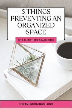 an open book with a cup of coffee next to it and the title 5 things preventing an organized space