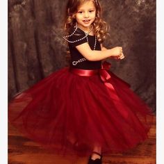 This Tulle Skirt Is Perfect For A Special Occasion. Made With Layers Of Burgundy Tulle, It Has Elastic Waistband And Is Fully Lined. Includes Satin Sash. Elegant Red Tulle Tutu Dress, Elegant Red Tutu Dress For Dress-up, Princess Style Red Tutu Dress, Holiday Costume Party Tutu Dress, Red Princess Style Tutu Dress, Princess Red Tulle Tutu Dress, Princess Style Red Tulle Tutu Dress, Red Princess Tutu Dress For Costume Party, Red Tulle Tutu Dress For Christmas