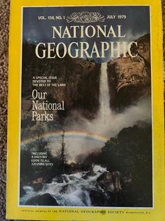 the front cover of national geographic magazine, featuring a waterfall and rainbow in the background