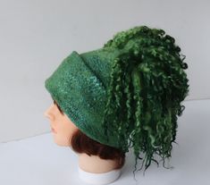 Felted hat, Green wool hat, Felt winter warm hat, Curly free Wool Hat Unisex, Warm felt hat This felted hat was made of soft merino wool and wool locks  through a wet felting process.  Felt hat is decorated with , wool locks  You can make folds and wearing a hat on the different ways. Felted hat is warm and perfect for cold weather.   Head circumference 58-59 cm (22,5''-23'') Full height caps without locks  23 см (9.1 in) The scarf for the set https://www.etsy.com/listing/739219323/felt-fur-curly-scarf-rustic-green-hand Easy care. Hand wash in soap water. Rinse, let it dry. Steam iron. Thanks, for visiting my shop Ready to ship Felted Hat, Hat Wool, Green Hand, Wool Winter, Wearing A Hat, Steam Iron, Green Wool, Wet Felting, Felt Hat