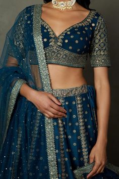 Midnight blue lehenga with all-over paisley prints and aari hand embroidery. Comes with embroidered padded blouse and dupatta.
Components: 3
Pattern: Printed, Hand Embroidered
Type Of Work: Paisley, Aari
Neckline: Leaf
Sleeve Type: Short
Fabric: Silk Dupion
Color: Blue
Other Details: 
Back tassel tie-up
Length:
Blouse: 13 inches
Lehengas: 44 inches
Weight: 1kg
Occasion: Wedding - Aza Fashions Blue Unstitched Choli For Transitional Season, Transitional Blue Lehenga With Dupatta, Blue Lehenga With Dupatta, Transitional Season Blue Lehenga With Dupatta, Transitional Designer Blue Lehenga, Transitional Season Designer Blue Lehenga, Blue Choli With Dupatta For Transitional Season, Blue Choli For Reception And Transitional Season, Transitional Embroidered Blue Choli