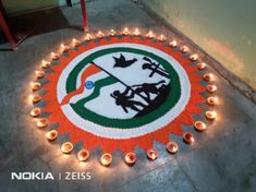 candles are lit in the shape of a circle with an image of india on it